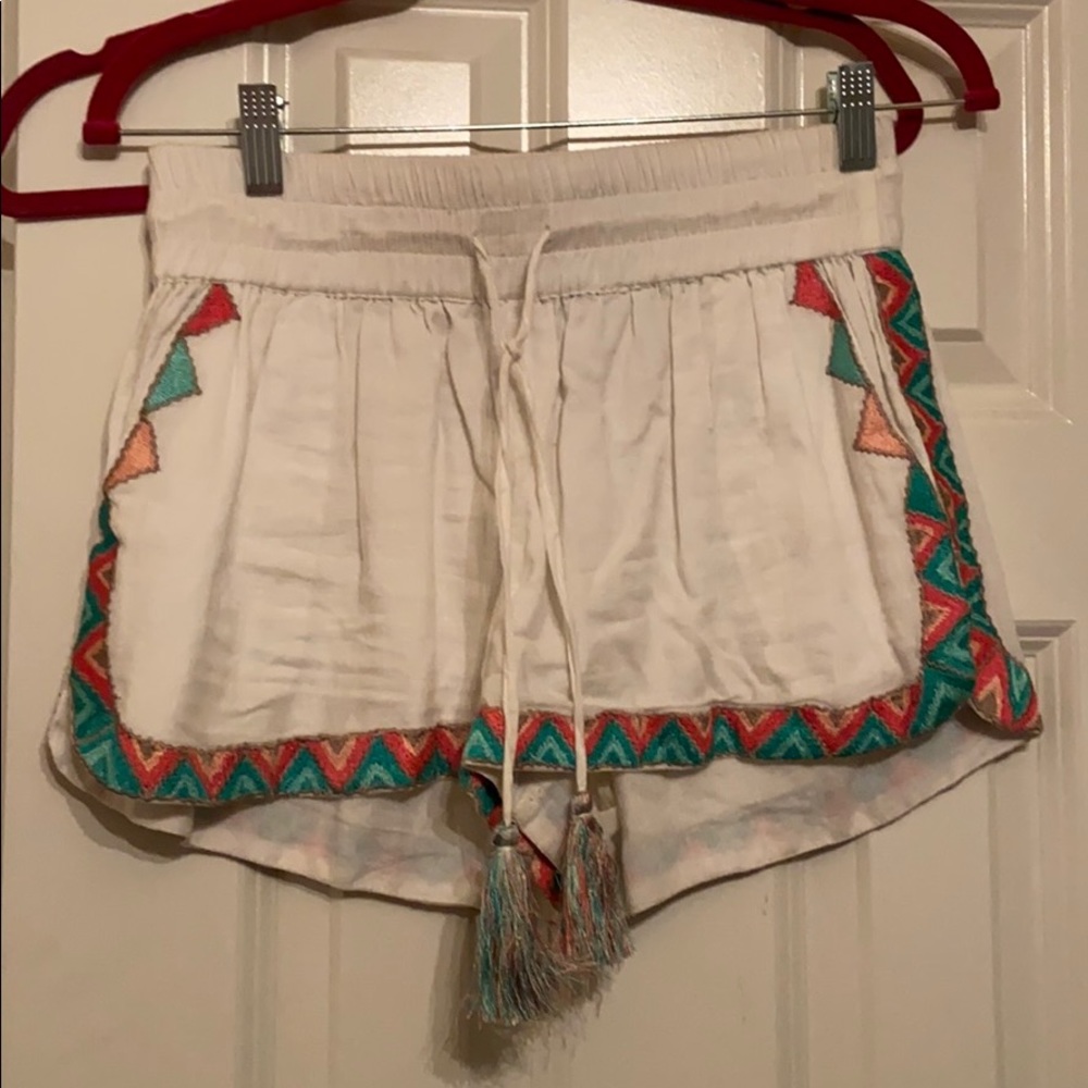 White shorts with pattern on the bottom